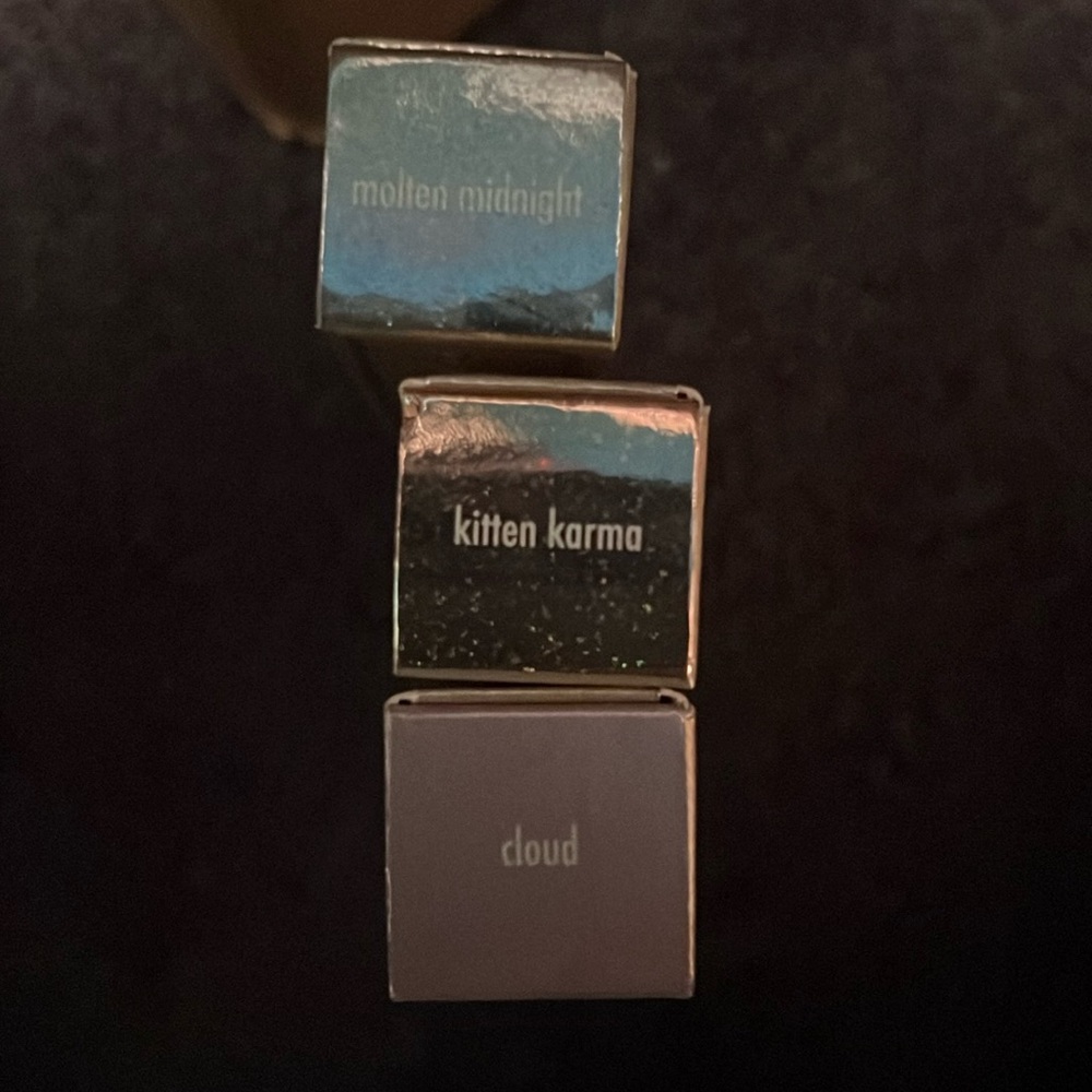 Stilas Liquid Eyeshadow in Kitten Karma, Molten Midnight and Cloud.